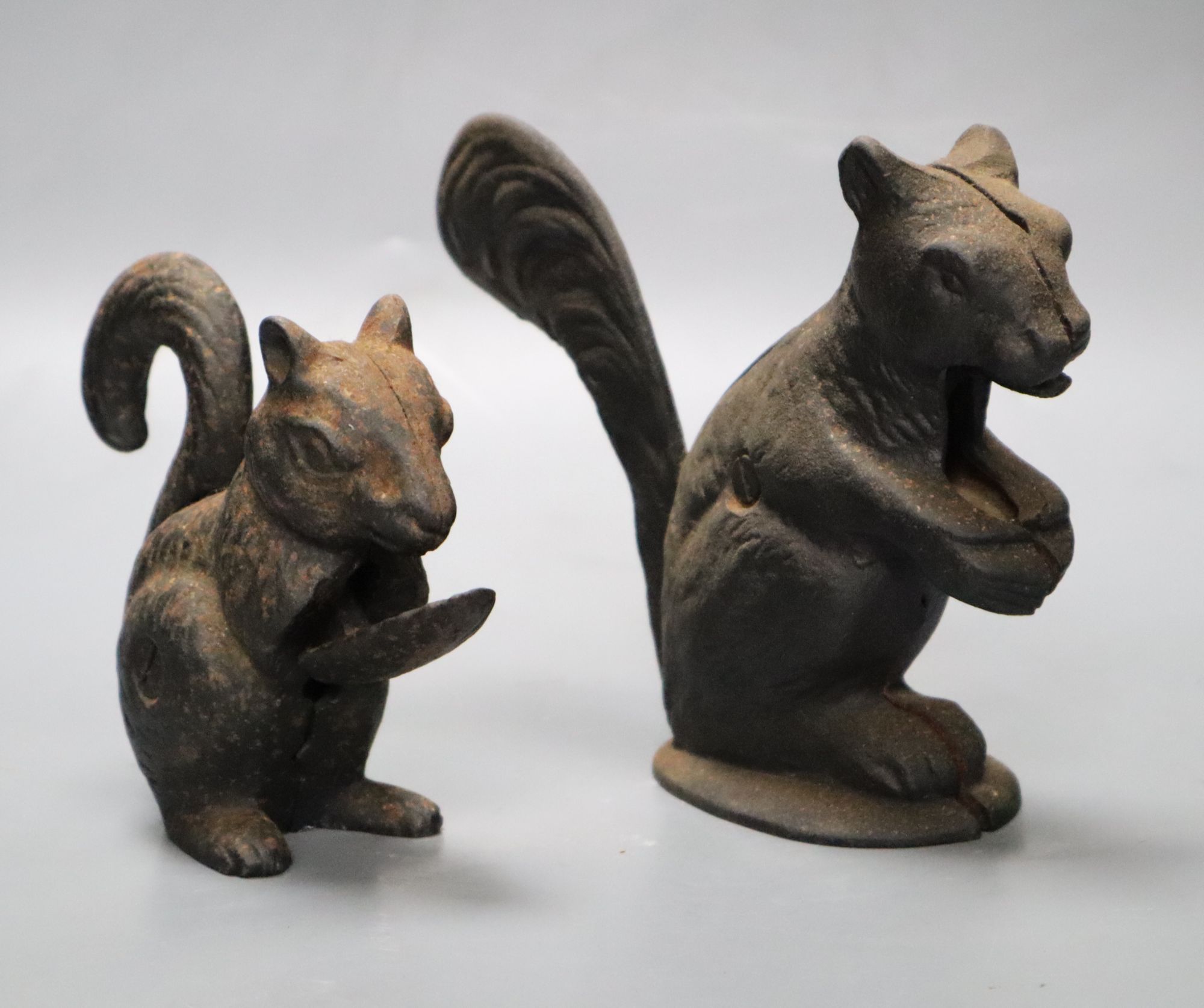 Two cast iron squirrel nutcrackers, tallest 13.5cm